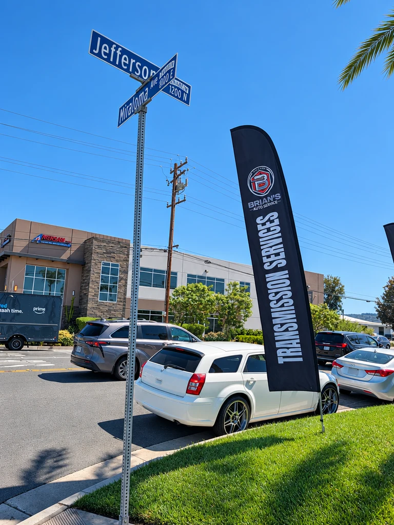Transmission Services flag by the Jefferson St. and Miraloma Ave street sign in Anaheim